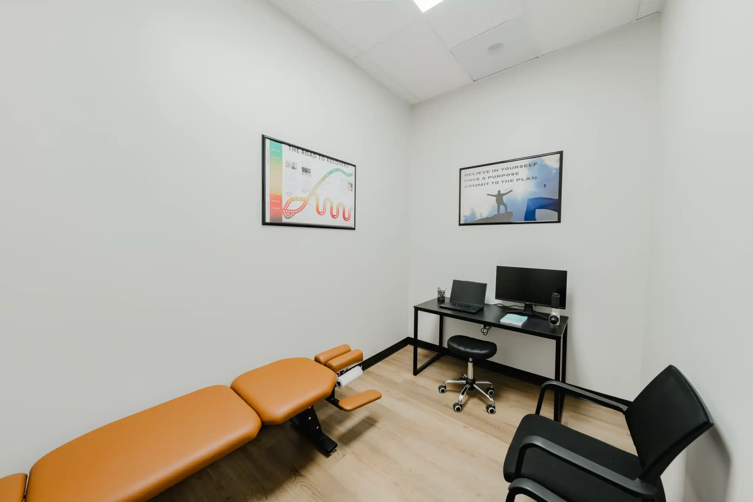 Comfortable private consultation room with adjustment table and desk at your chiropractor in Alliance, also serving as a chiropractor near Alliance and in North Fort Worth.